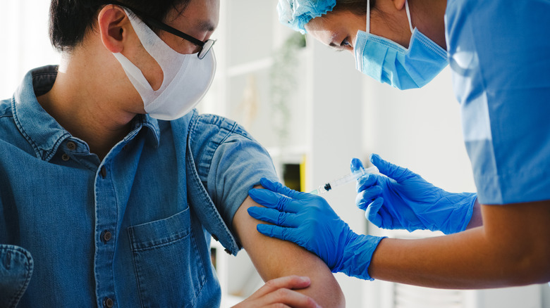 man getting vaccine