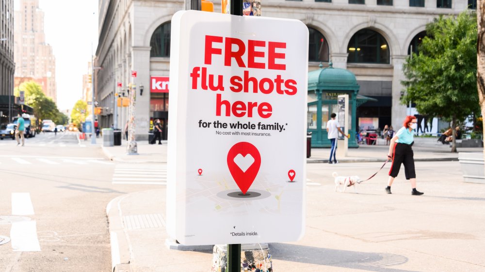 Poster on a city street advertising flu shots