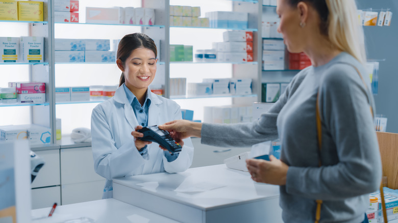 woman purchasing medicine 