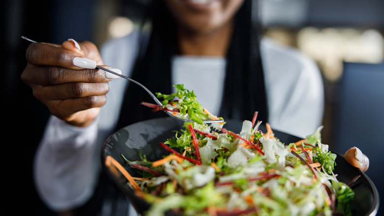 Woman holding a salad