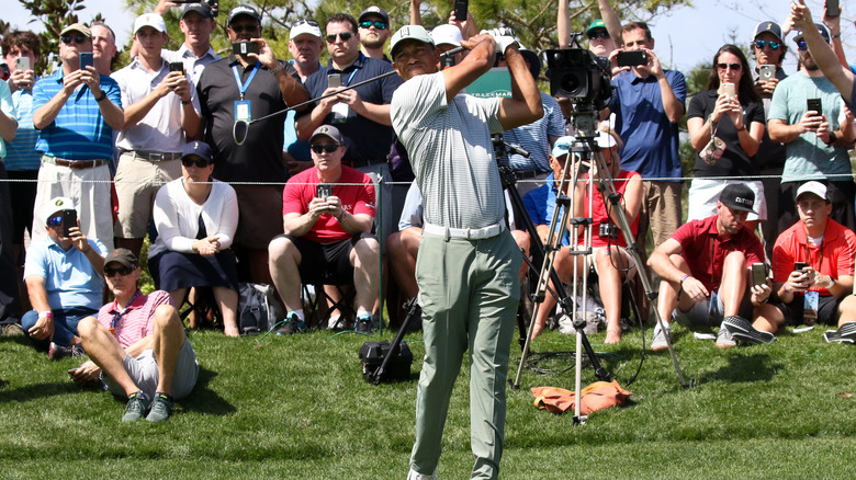 Tiger Woods playing golf after surgery