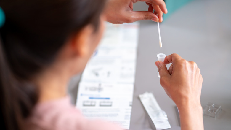 woman taking a covid test