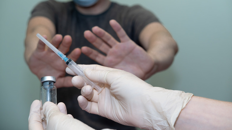 patient refusing to get vaccinated