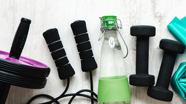 Dumbbells, jump rope, and ab roller