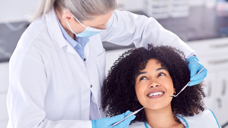 Smiling young woman at dentist