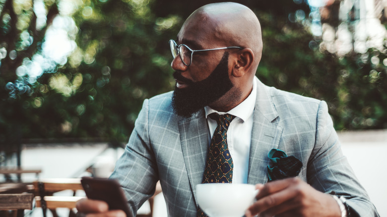 Bald man in suit at lunch