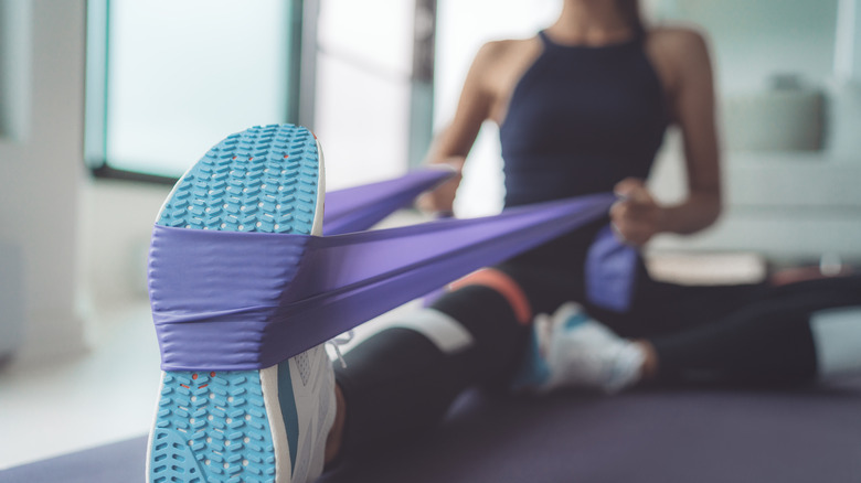 Woman stretching her leg