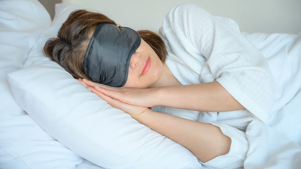 Woman sleeping with eye mask