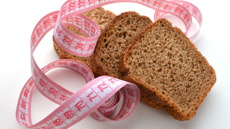 slices of bran bread with measuring tape