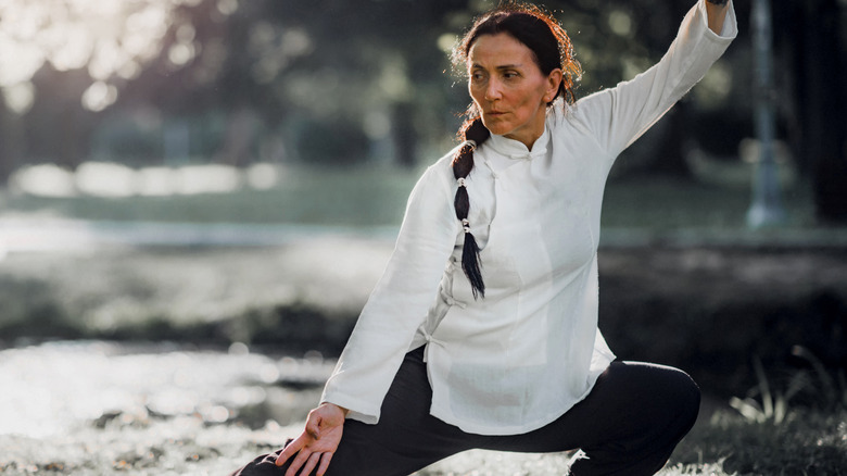 woman practicing tai chi