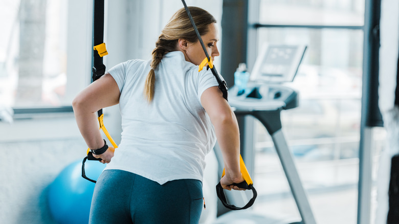 Woman using resistance band