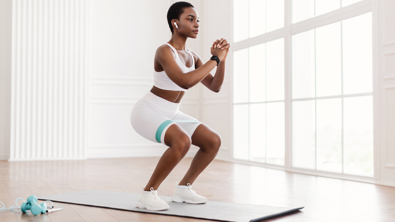 Woman doing a squat