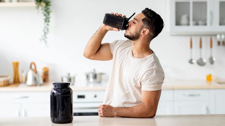 A man drinks a protein shake
