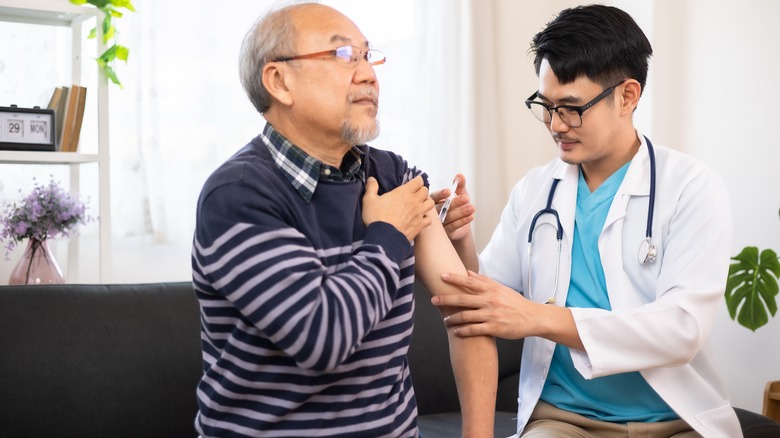 Older man getting vaccinated