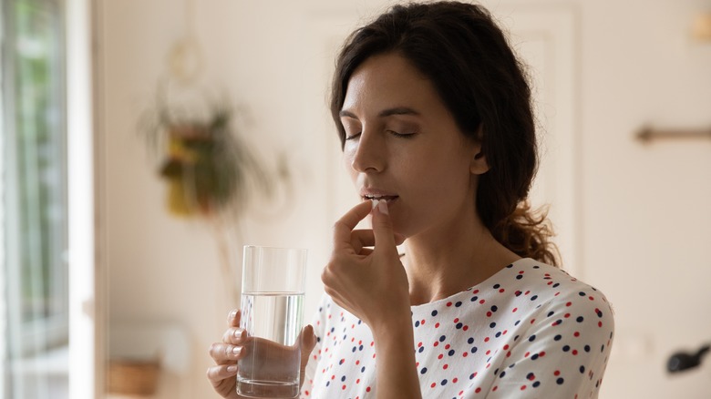 woman taking medication