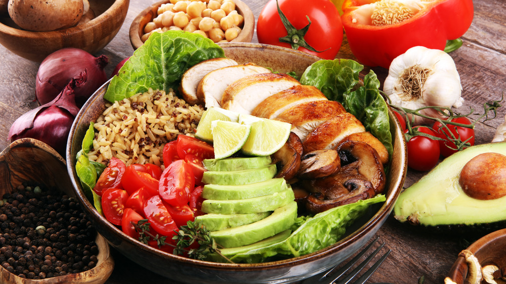 Dish with quinoa and rice pilaf, vegetables, chicken