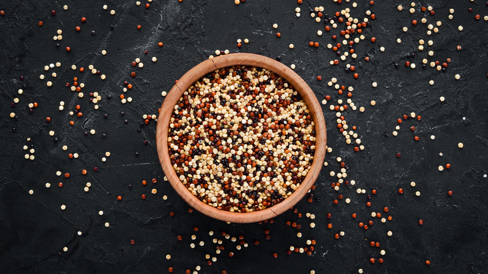 Tri-colored quinoa in a wooden bowl