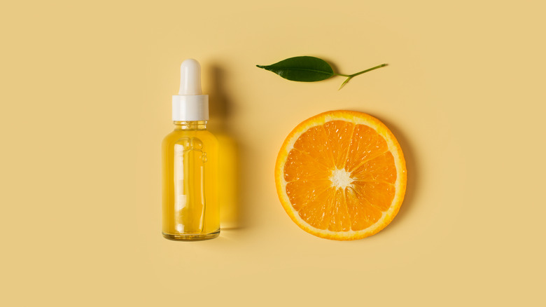 Serum bottle and orange slice