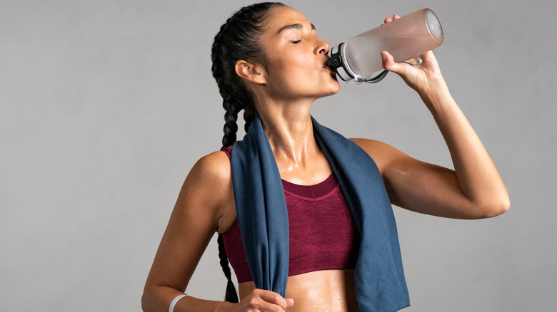 Woman post-exercise drinking water