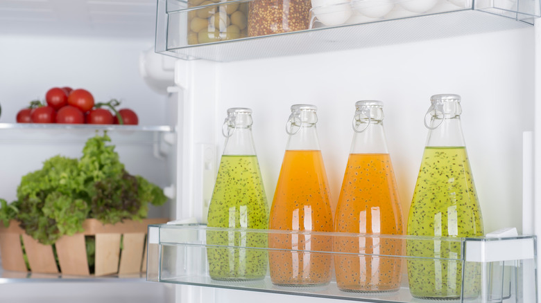 an open fridge full of fresh produce and bo