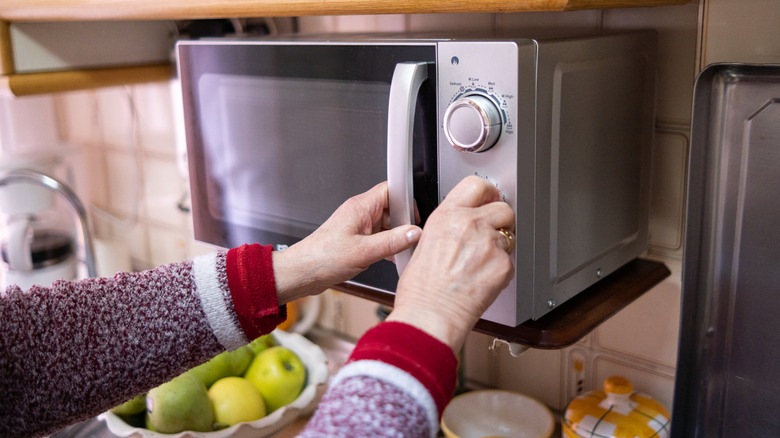 woman using a microwave