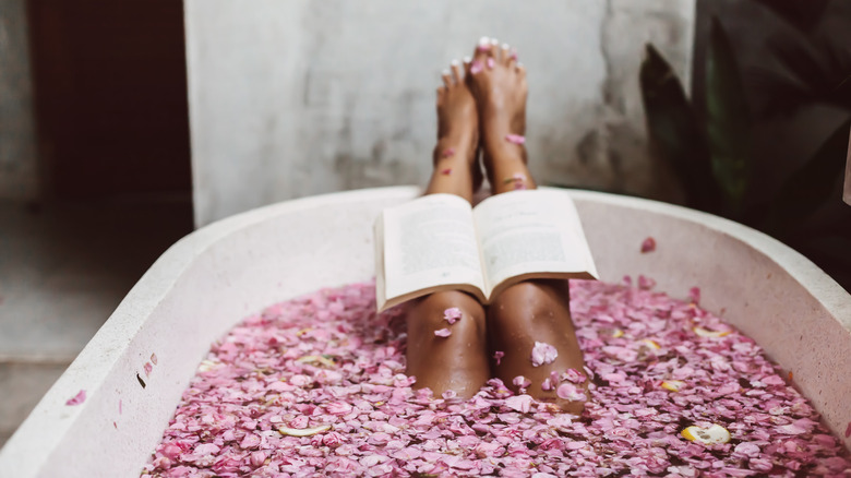 Women's legs in bath tub