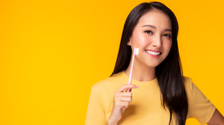 Woman holding a toothbrush 