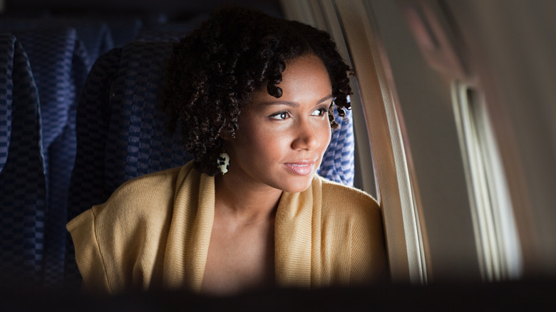 Woman sitting in airplane