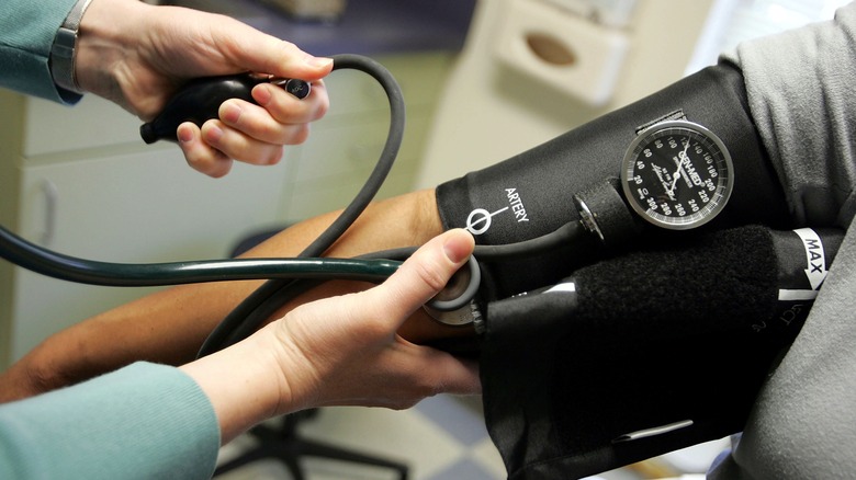 checking blood pressure