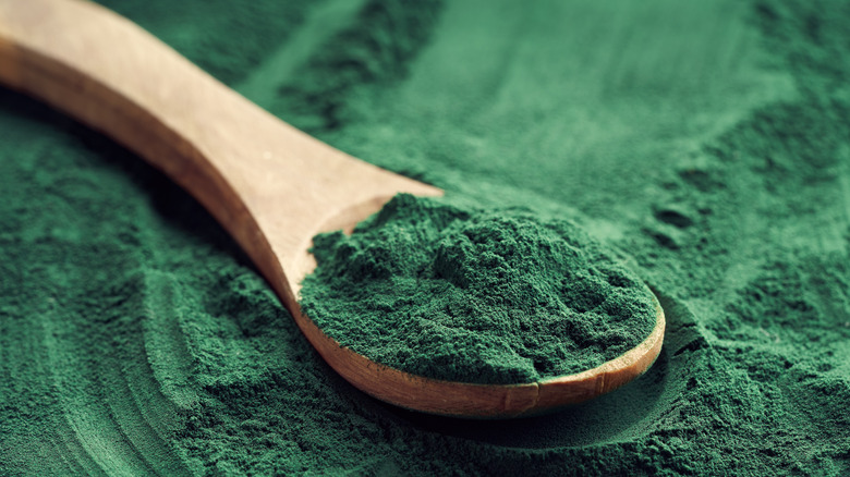 Wooden spoon with green powder