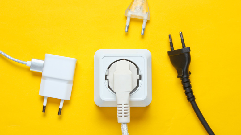Multiple electric wires on yellow background
