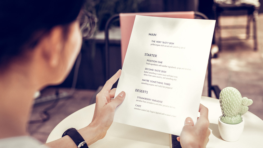 Woman looking at menu