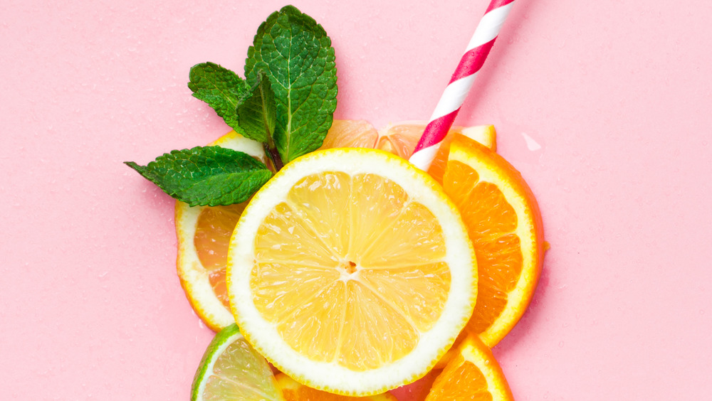 stripped straw stuck into citrus slices 