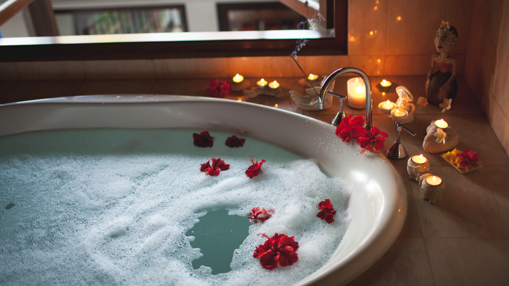 couple in round bath tub