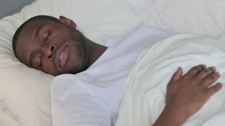 Man asleep in bed