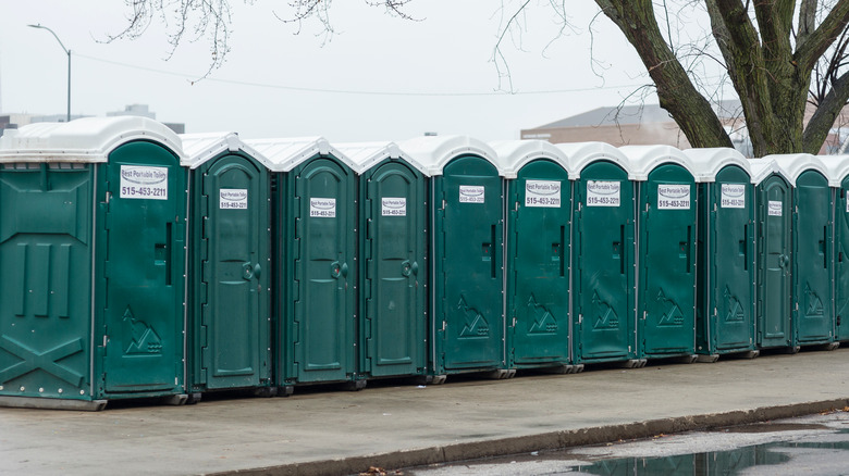 a row of green port a potties