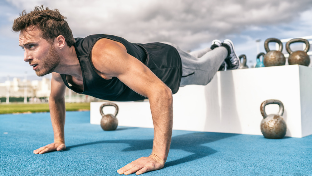 man doing incline push-up