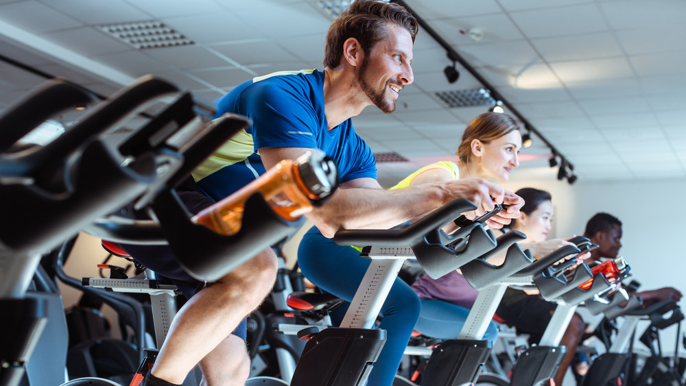 Man in cycling class on bike