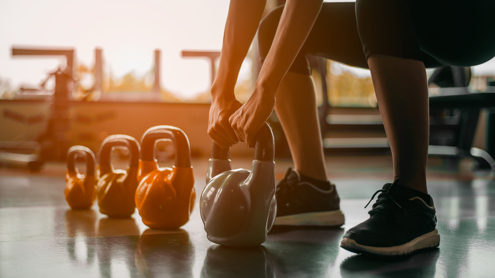Woman working out with kettlebells