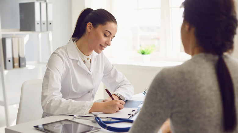 A woman is at a doctor's visit