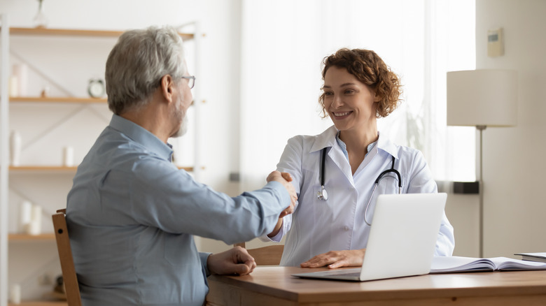 A man talks to his doctor at an appointment