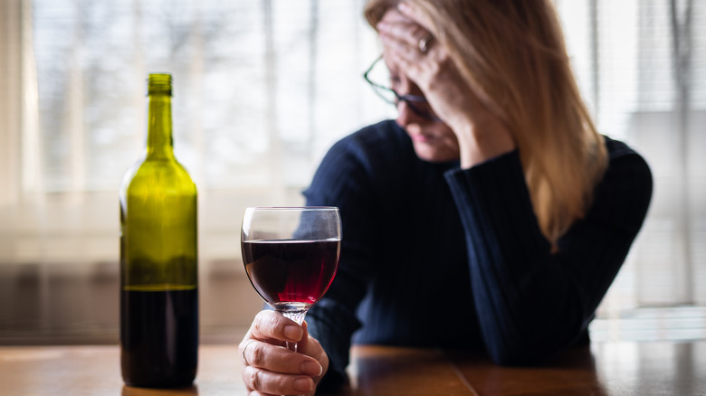 depressed woman drinking