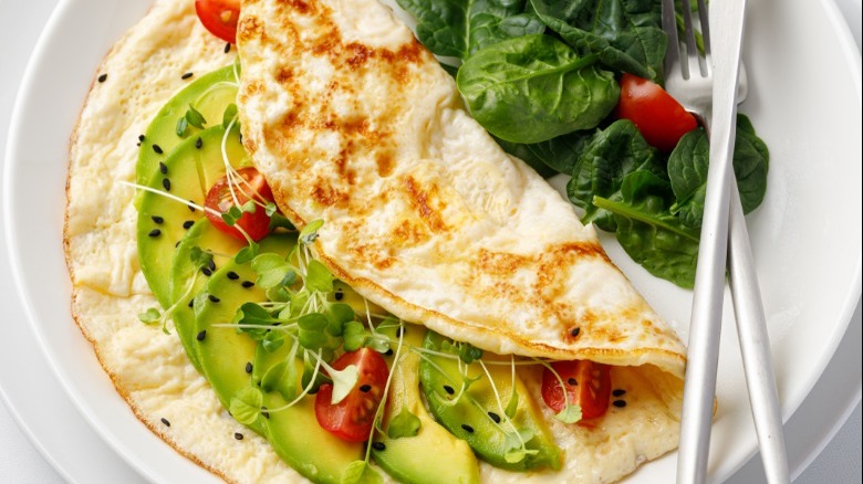 white omelet stuffed with vegetables
