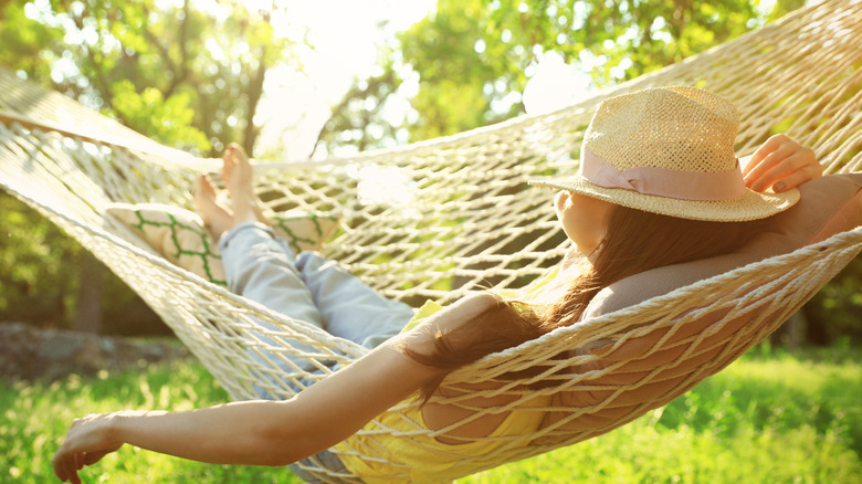 Woman sleeping in hammock