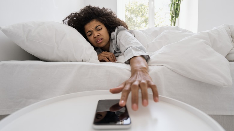 Woman touching phone 