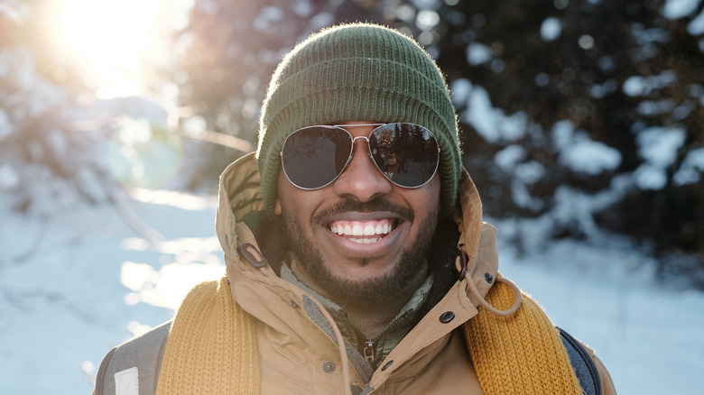 Smiling man outside in snow