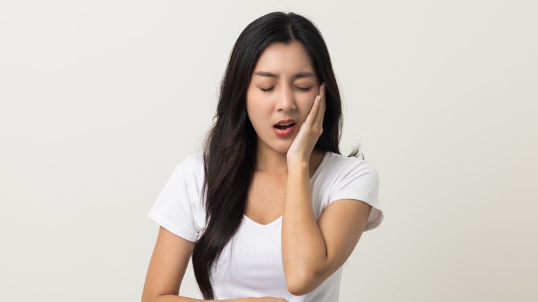 Woman with toothache pain