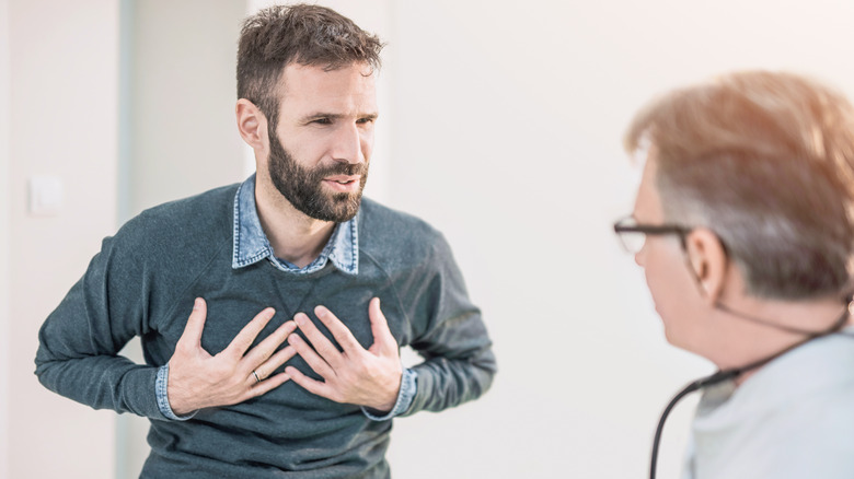 man talking to doctor about chest pain