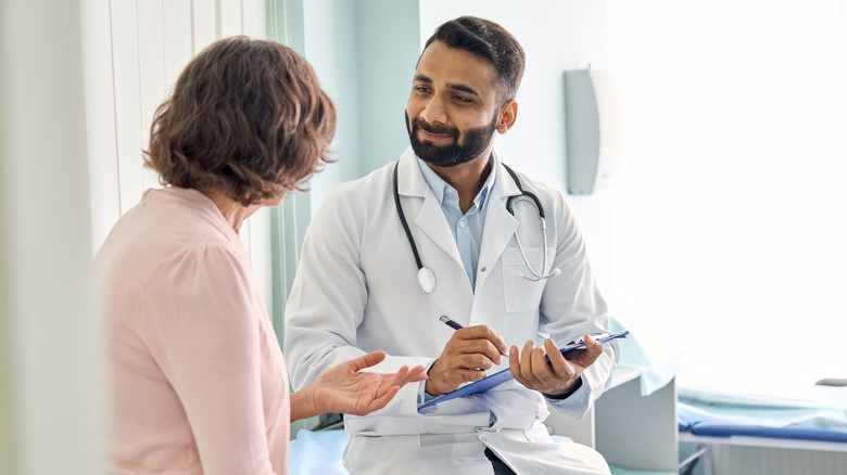 Doctor speaking with patient