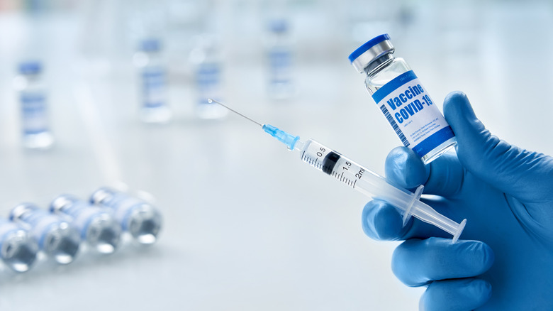 Needle and vial of COVID-19 vaccine 